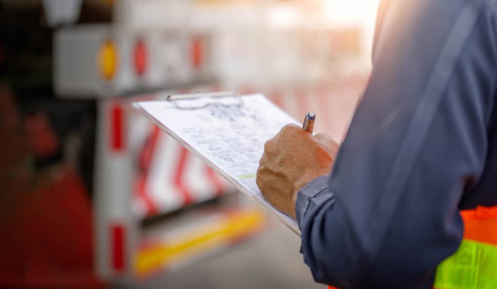 Safety inspection form being completed by a consultant